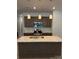 Modern kitchen featuring a central island with granite countertops and stainless steel appliances at 2910 Sloan Dr, Charlotte, NC 28208