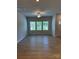 Bright, spacious living room with hardwood floors and large windows offering abundant natural light at 2910 Sloan Dr, Charlotte, NC 28208