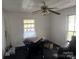 A bedroom with a large window and light walls needs TLC at 2925 Titman Rd, Gastonia, NC 28054