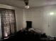 A sparsely furnished living room with dark carpet at 2925 Titman Rd, Gastonia, NC 28054