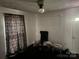 A sparsely furnished living room with dark carpet at 2925 Titman Rd, Gastonia, NC 28054