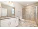 Modern bathroom featuring granite countertops, updated fixtures, a tiled floor, and a glass shower at 309 N Aspen St, Lincolnton, NC 28092
