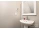 Contemporary half bathroom with pedestal sink, modern mirror, and updated fixtures at 309 N Aspen St, Lincolnton, NC 28092