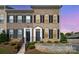Brick townhome featuring well-maintained landscaping and a front yard at 309 N Aspen St, Lincolnton, NC 28092