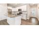 Modern kitchen offers granite countertops, stainless appliances, and bright white cabinetry at 309 N Aspen St, Lincolnton, NC 28092