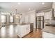 Modern kitchen island view of stainless appliances, hardwood flooring, and an open floor plan at 309 N Aspen St, Lincolnton, NC 28092