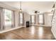 Spacious living room boasts a cozy fireplace, ample natural light, and luxury vinyl plank flooring at 309 N Aspen St, Lincolnton, NC 28092