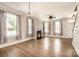 Spacious living room boasts a cozy fireplace, ample natural light, and luxury vinyl plank flooring at 309 N Aspen St, Lincolnton, NC 28092