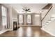 Living room boasts natural light, fireplace, neutral walls and hardwood floors at 309 N Aspen St, Lincolnton, NC 28092