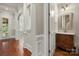 Bathroom includes a vanity with granite countertop, hardwood floors, neutral paint, and tub-shower combo at 310 Ridge Reserve Dr, Clover, SC 29710
