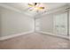 Neutral bedroom with a ceiling fan and windows with plantation shutters at 310 Ridge Reserve Dr, Clover, SC 29710