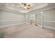 Versatile bonus room with neutral carpet, a ceiling fan, and French doors leading to the hallway at 310 Ridge Reserve Dr, Clover, SC 29710