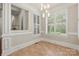 Bright dining room featuring plantation shutters, neutral paint, and hardwood tile floors at 310 Ridge Reserve Dr, Clover, SC 29710