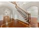 Elegant entryway boasting hardwood floors, staircase with iron railings, and arched doorways at 310 Ridge Reserve Dr, Clover, SC 29710