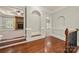 Inviting foyer with hardwood floors, archways, and views into the living room with a stone fireplace at 310 Ridge Reserve Dr, Clover, SC 29710