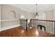 Elegant foyer with hardwood floors, a decorative chandelier, coffered ceiling, and decorative molding at 310 Ridge Reserve Dr, Clover, SC 29710