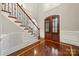 Elegant foyer featuring hardwood floors, staircase with iron railings, and a grand entrance at 310 Ridge Reserve Dr, Clover, SC 29710