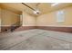 Spacious two car garage with brick accents and interior stairs at 310 Ridge Reserve Dr, Clover, SC 29710