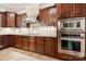 Gourmet kitchen boasts stainless steel appliances, granite countertops and custom cabinetry at 310 Ridge Reserve Dr, Clover, SC 29710