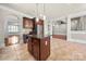 Spacious kitchen with island, custom cabinets, stainless appliances and tiled floors at 310 Ridge Reserve Dr, Clover, SC 29710