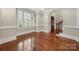 Open living room with hardwood floors, crown molding, and natural light at 310 Ridge Reserve Dr, Clover, SC 29710