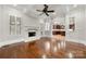 Open floorplan living room has hardwood floors, fireplace, arched doorway, and neutral paint at 310 Ridge Reserve Dr, Clover, SC 29710