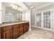 Luxurious main bathroom with dual sinks, granite countertop, dark wood cabinets, tile floor, and a walk-in shower at 310 Ridge Reserve Dr, Clover, SC 29710