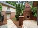 Backyard exterior includes a brick fireplace and landscaped yard at 310 Ridge Reserve Dr, Clover, SC 29710