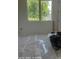 Bedroom with a large window providing natural light, new flooring and freshly painted walls at 312 Wesley Heights Way # B, Charlotte, NC 28208