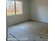Bright bedroom featuring newly installed flooring and a large window offering natural light at 312 Wesley Heights Way # B, Charlotte, NC 28208