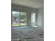 Bright bedroom with large windows offering outdoor views and natural light at 312 Wesley Heights Way # B, Charlotte, NC 28208