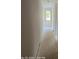 Hallway featuring freshly painted walls and an exterior door at the end at 312 Wesley Heights Way # B, Charlotte, NC 28208