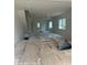 Spacious open-concept living room with natural light streaming through the windows at 312 Wesley Heights Way # B, Charlotte, NC 28208