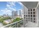 Balcony view featuring buildings and trees on a sunny day at 333 W Trade St # 1500, Charlotte, NC 28202