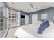 Bright bedroom featuring floor-to-ceiling windows and a ceiling fan at 333 W Trade St # 1500, Charlotte, NC 28202