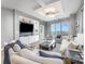 Bright living room featuring a large window and custom built-ins at 333 W Trade St # 1500, Charlotte, NC 28202