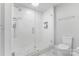 Contemporary walk-in shower featuring glass enclosure and tiled walls at 333 W Trade St # 1500, Charlotte, NC 28202