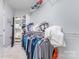 Spacious walk-in closet with ample shelving and hanging space for storage at 333 W Trade St # 1500, Charlotte, NC 28202