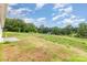The lush, grassy backyard features mature trees providing shade and a serene atmosphere at 3478 Winters St, Newton, NC 28658