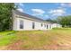 View of the backyard featuring a well-maintained lawn and lush trees, perfect for outdoor enjoyment at 3478 Winters St, Newton, NC 28658