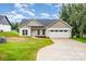 Charming single-story home featuring a manicured lawn, two-car garage, and neutral siding at 3478 Winters St, Newton, NC 28658