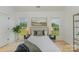 Comfortable bedroom featuring hardwood floors, natural light from the two windows, and neutral decor at 3478 Winters St, Newton, NC 28658