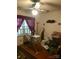 Bedroom showing an ironing board, dark drapes, and an array of assorted items at 3715 Vanderburg Dr, Concord, NC 28025