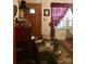 Entryway with dark wood door, patterned rug and a stack of boxes and other personal items at 3715 Vanderburg Dr, Concord, NC 28025