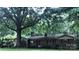 Charming single-story home with a mature tree-lined front yard and brick exterior at 3715 Vanderburg Dr, Concord, NC 28025