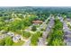 Stunning aerial view of a home nestled in a lush, green neighborhood with mature trees at 3741 Tea Olive Rd, Gastonia, NC 28056