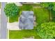 Aerial view of a home with a large yard, a deck, and mature trees at 3741 Tea Olive Rd, Gastonia, NC 28056