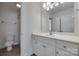 Bright bathroom with white vanity, framed mirror, and tiled shower at 3741 Tea Olive Rd, Gastonia, NC 28056