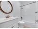 Bathroom featuring a white vanity, round mirror, toilet, and shower/tub combo at 3741 Tea Olive Rd, Gastonia, NC 28056