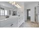 Bathroom featuring double sinks, a large mirror, and a glass-enclosed shower at 3741 Tea Olive Rd, Gastonia, NC 28056